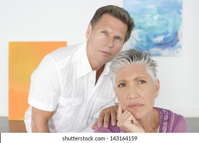 Closeup Of Thoughtful Mature Couple In Art Gallery