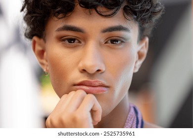 Close-up of thoughtful transgender transgender woman resting chin on hand, looking pensive. Contemplation, expression, face, thinking, introspection, identity - Powered by Shutterstock