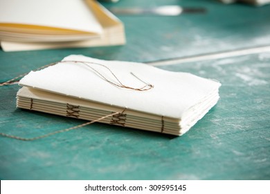 Closeup of thread and papers on table in factory