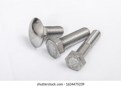 Closeup of threaded elements of hardware, such as screws and bolts,  on the white background 