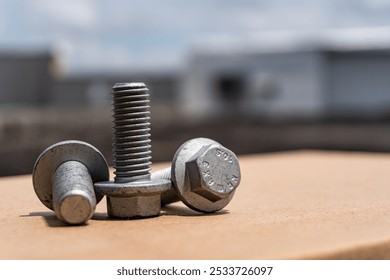 Close-up of three hexagonal flange screws