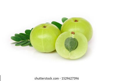 Closeup three Indian gooseberry fruits or Amla berry ( phyllanthus emblica ) with green leaf and sliced isolated on white background. 