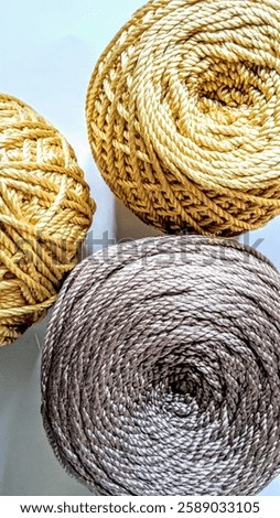 Similar – Image, Stock Photo Close-up of golden yarn bundles in textile production