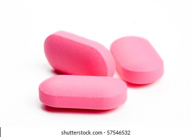 Closeup Of Three Pink Pills