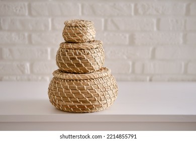 Close-up Of Three Round Stream Box With Lid On White Table. Wicker Caskets For Storage On A White Background. Household Items