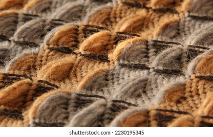 Closeup of threedimensional waffle weave pattern in orange and grey