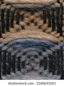 Closeup of threedimensional waffle weave pattern in orange and grey