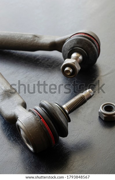 Close-up of Tie Rod or Ball Joints. New spare part\
for steering tie rod. Trade in spare parts or car service.\
Selective focus