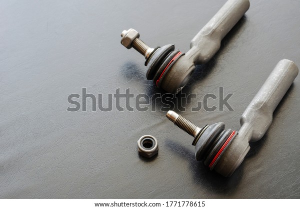 Close-up of Tie Rod Ends or Ball Joints. New spare\
part for steering tie rod. Trade in spare parts or car service.\
Selective focus