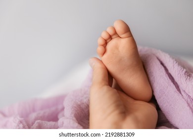 Closeup Of Tiny Foot In Mother's Hand, Candid Babyhood And Motherhood Concept - Image