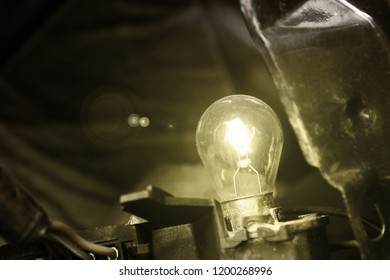 Closeup of a tiny light inside of a car still shining