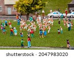 Closeup of tiny model morris dancers at a model village
