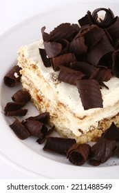 Closeup Of A Tiramisu Slice With Chocolate Curls On Top