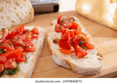 Close-up of tomato bruschetta on artisan bread slices, featuring fresh chopped tomatoes and herbs on a wooden board. - Powered by Shutterstock