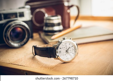 Closeup Toned Shot Of Male Watches Lying On Table Against Photography Retro Set
