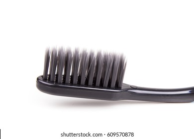 Closeup Of Toothbrush Head With Charcoal Soft And Slim Tapered Bristle