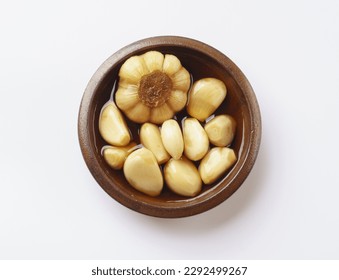 Close-up and top angle view of pickled garlic with soy sauce on a jar, South Korea
 - Powered by Shutterstock