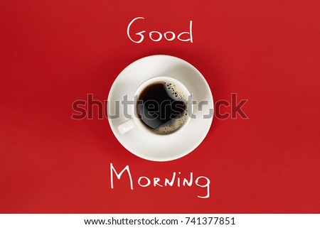 Close-up top view of cup of fresh hot coffee and good morning inscription