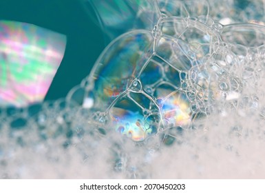 Close-up top view of foamy surface of clean water. Abstract foamy background.