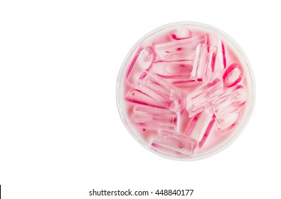 Closeup top view ice of strawberry sweet milk pink in  takeaway cup on white background