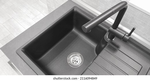 Close-up top view integrated single basin bowl sink with drainboard, dark color. Wing for drying utencil with grooves for draining water. Mixer tap of same material, neutral light kitchen background - Shutterstock ID 2116094849