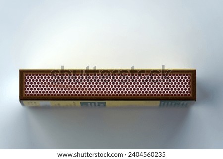 Close-up top view of matchbox lying on white background. Photo taken December 24th, 2023, Zurich, Switzerland.