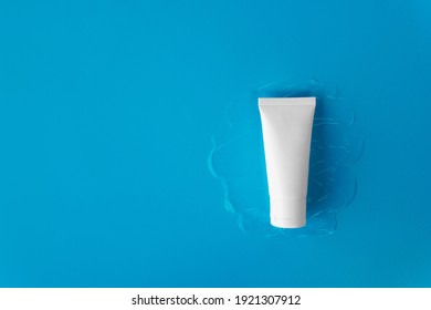 Closeup Top View Mockup Blank Label Facial Moisturiser Hyaluronic Acid Skincare White Tube Bottle Product On Transparent Gel Texture Plain Solid Light Blue Background And Copy Or Negative Space