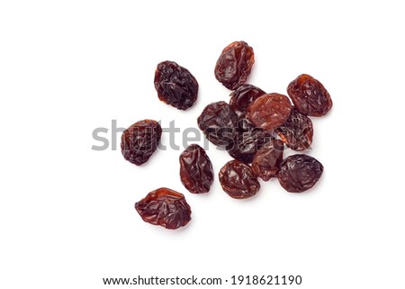 Close-up top view of Raisins isolated on white background.