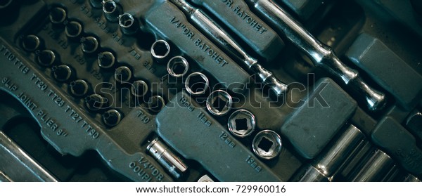 Closeup top view of set metallic tools kit, home\
workshop garage concept