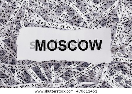 Closeup torn pieces and tapes of paper with the word MOSCOW. Black and White image. Concepts of money and business.
