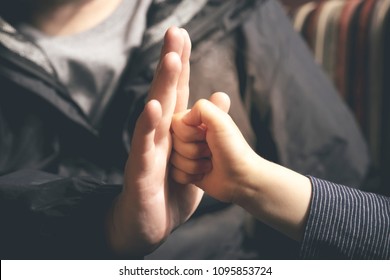 Closeup of touching with punches hands of Father and Son in retro filter, Son punching his Father hand, Dad is training his son boxing, - Shutterstock ID 1095853724