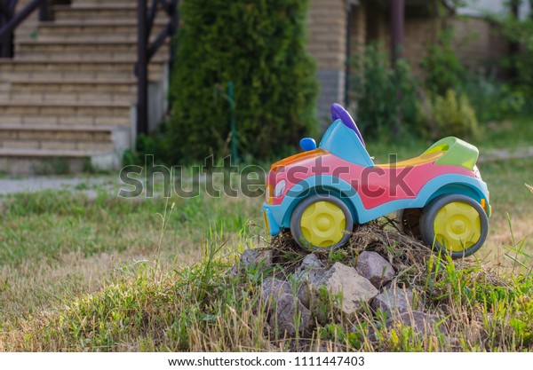 Close-up of a toy car in the\
garden