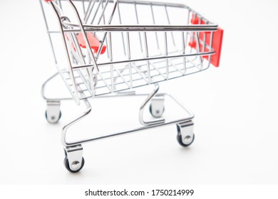 Close-up of toy shopping cart on white background. Soft focus
 - Powered by Shutterstock