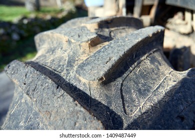 Close-up Of Tractor Tyre Texture Detail. Background. Heavy Machinery.