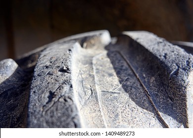 Close-up Of Tractor Tyre Texture Detail. Background. Heavy Machinery.