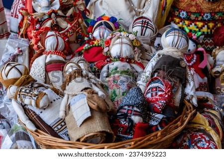 Close-up of a traditional amulet doll for sale to tourists at a street market in Kyiv, Ukraine. Ukrainian motanka dolls