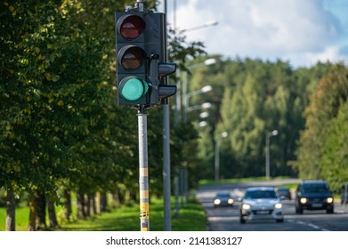 Closeup Of Traffic Semaphore With Green Light On Defocused City Street 