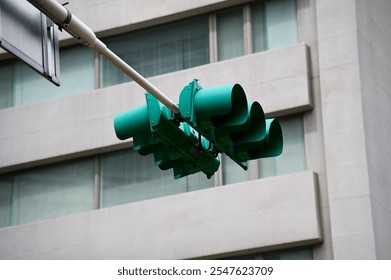 Close-up of the traffic signal lights with building in the background. For vehicle. Traffic light in Taipei city. Cityscape and transportation concept. - Powered by Shutterstock