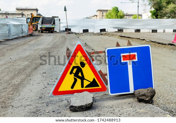 Closeup traffic stop sign, detour, repair,\
reconstruction of the road in the\
city