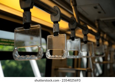 Close-up to Train handle in selected focus by public transportation that isolated from background