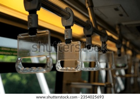Close-up to Train handle in selected focus by public transportation that isolated from background