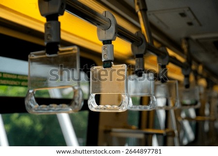 Close-up to Train handle in selected focus by public transportation that isolated from background