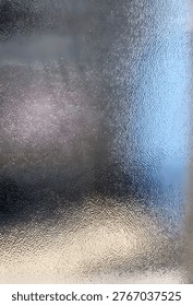 Close-up of translucent bumped glass surface texture for privacy window or shower door.
