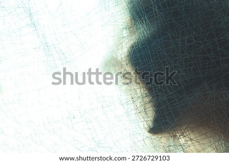 Close-up of translucent surface with intersecting mesh lines and shadowed form behind, creating layered texture.ambiguity and entrapment, symbolizing fragmentation, perception, and abstract human presence.