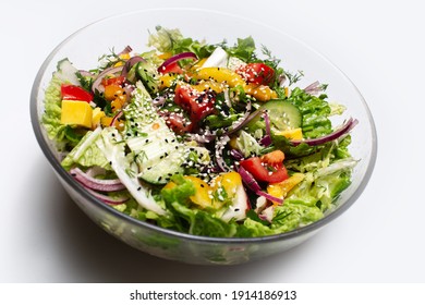 Close-up Of Transparent Bowl With Green Salad On White Background.