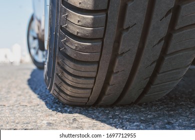 Closeup of the tread of a summer car tire on a sunny day.
Transport safety concept
