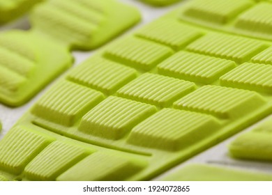 Close-up Of The Tread Of A Yellow Sneaker, The Textured Pattern Of The Sole. Macro