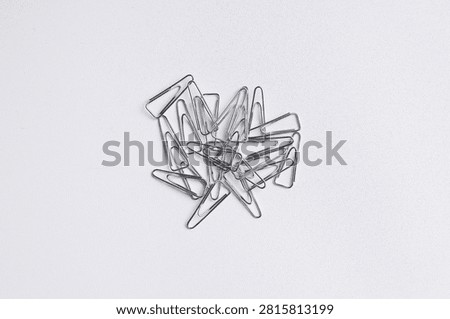 Close-up of a triangular paper clip.