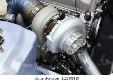 Close-up turbo engine on car bonnet for modify and tune up power speed of car