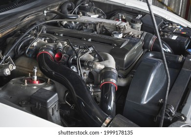 Close-up of Turbocharged Inline Six Cylinder Engines in Japanese Sport cars.